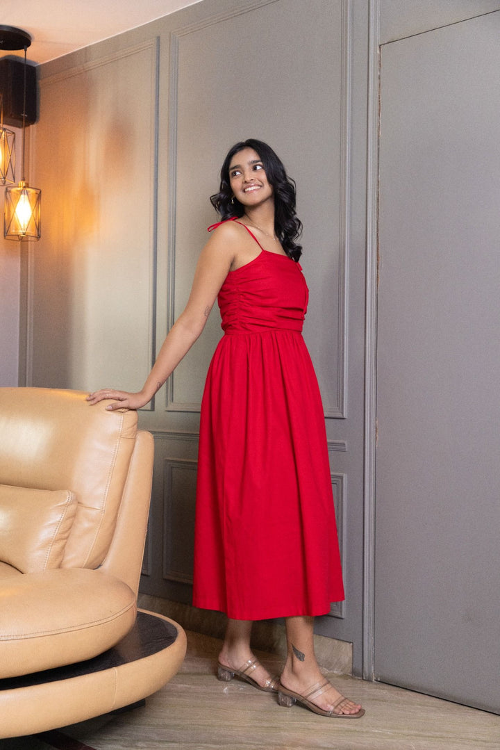 Red midi dress with ruched bodice and tie straps