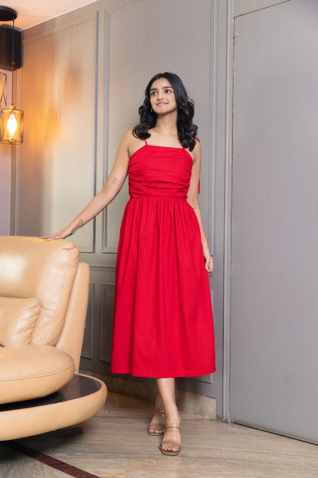 Red midi dress with ruched bodice and tie straps