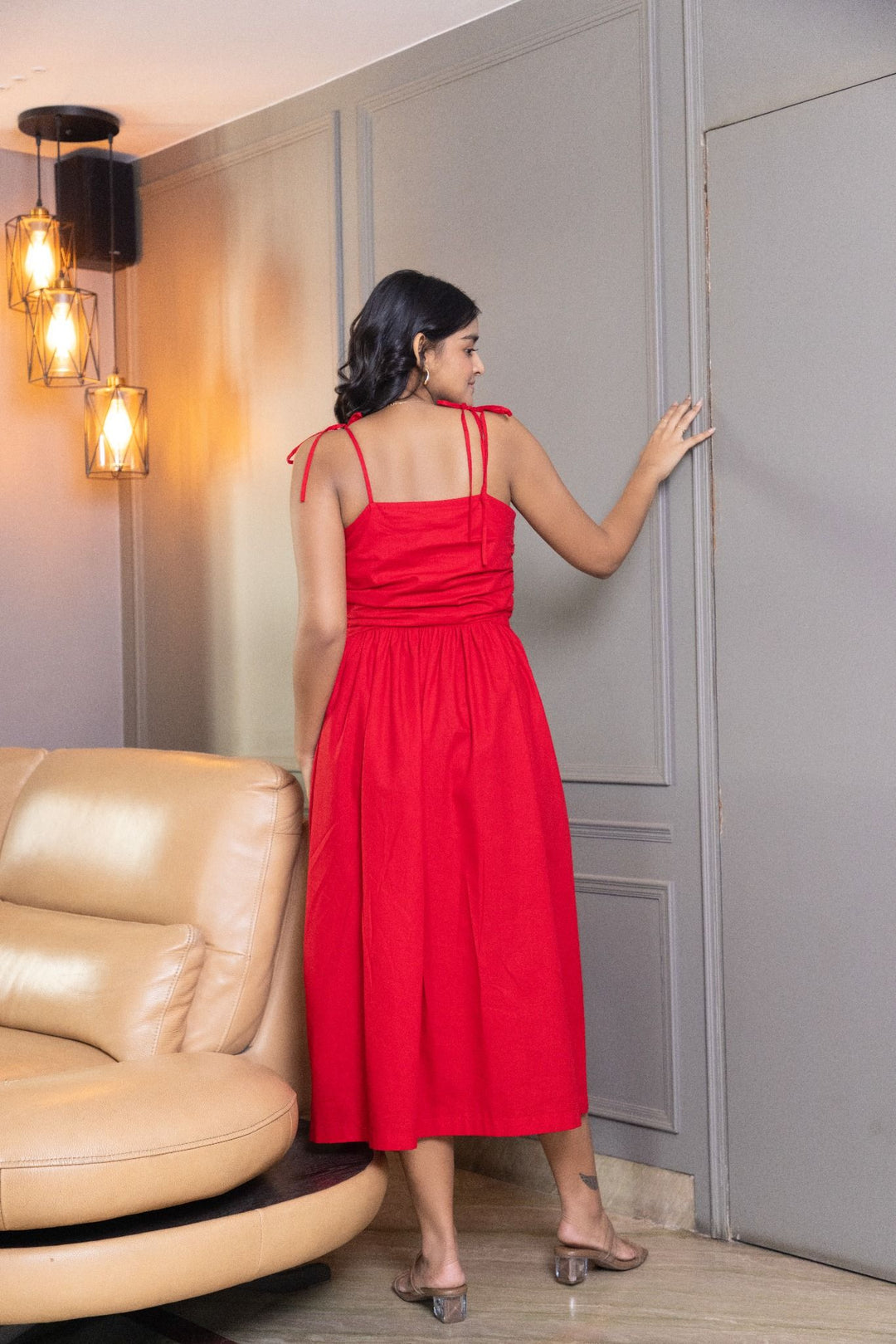 Red midi dress with ruched bodice and tie straps