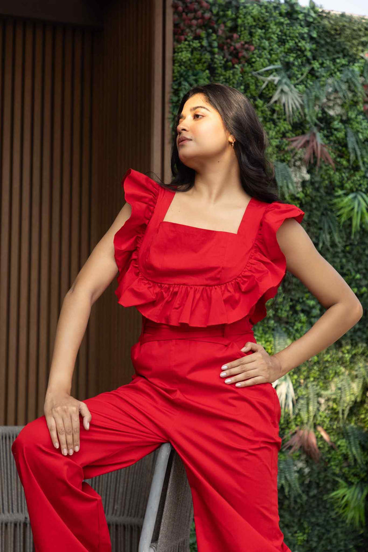 Red ruffled cotton jumpsuit with wide-leg silhouette