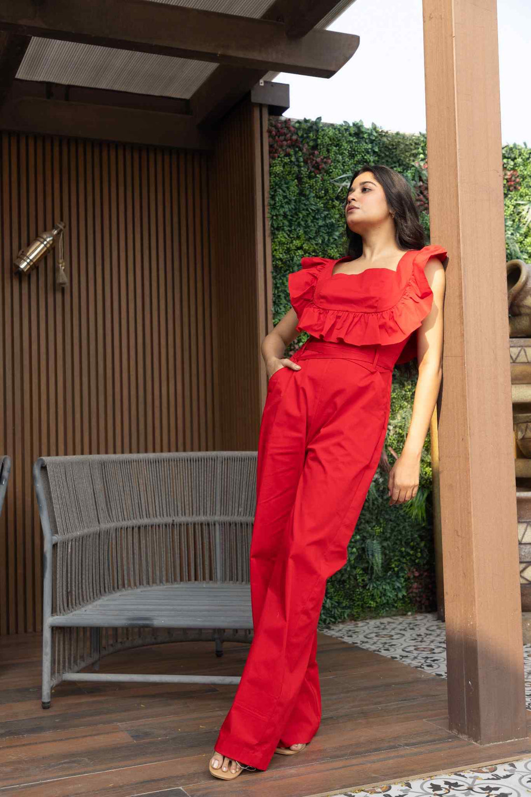 Red ruffled cotton jumpsuit with wide-leg silhouette