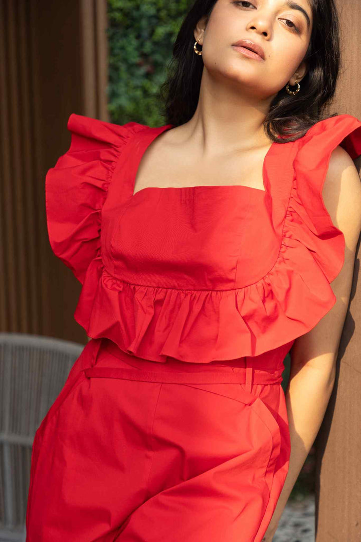 Red ruffled cotton jumpsuit with wide-leg silhouette