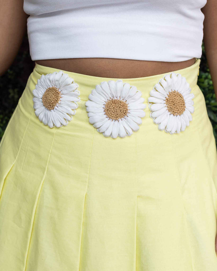 Yellow high-waisted midi sunflower skirt with three white sunflower appliqués at the waist